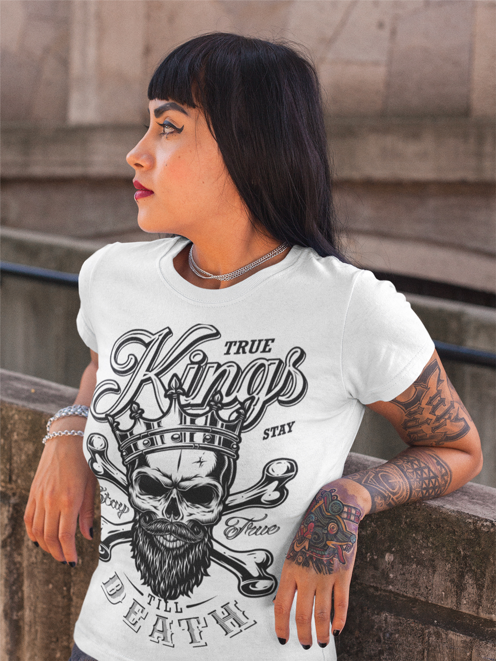 portrait-of-a-bored-hispanic-tattooed-girl-lying-against-a-concrete-structure-a17173.jpg